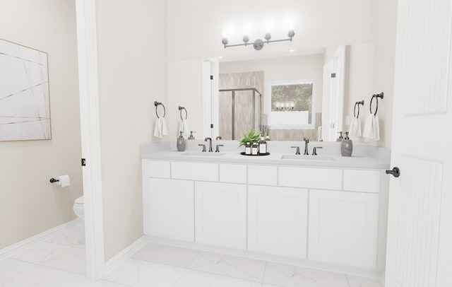 bathroom with marble finish floor, a stall shower, a sink, and baseboards