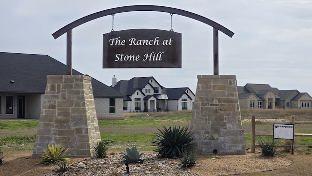 community / neighborhood sign featuring a residential view