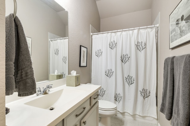 bathroom featuring toilet, tile patterned floors, and vanity