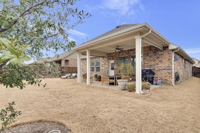 exterior space featuring a fenced backyard and ceiling fan