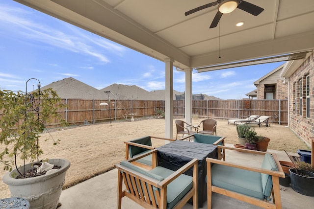 view of patio with a fenced backyard and ceiling fan