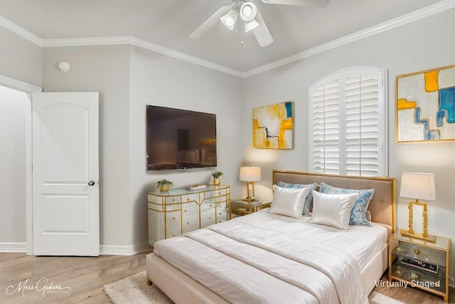 bedroom featuring ceiling fan, ornamental molding, light wood-type flooring, and baseboards