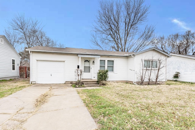 single story home with a front yard, concrete driveway, and an attached garage