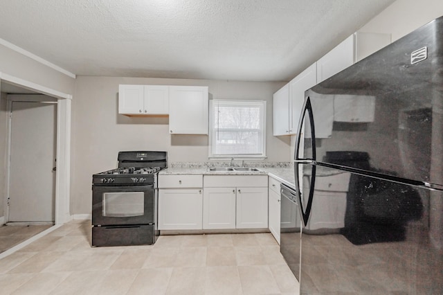 kitchen with white cabinetry, a sink, a textured ceiling, and black appliances