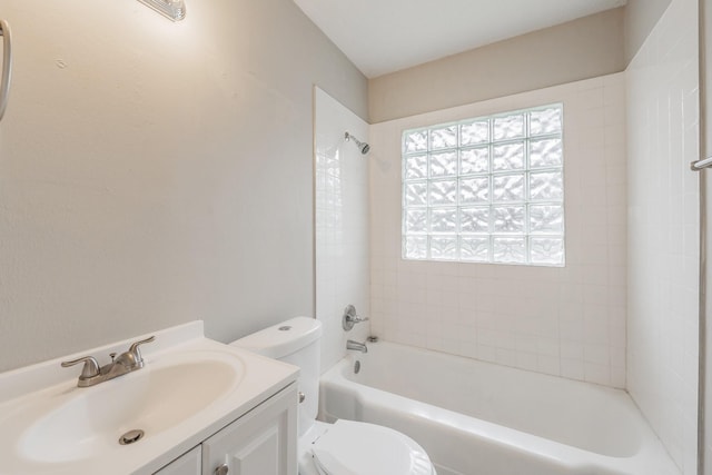 bathroom with toilet, shower / washtub combination, and vanity