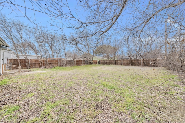 view of yard with a fenced backyard