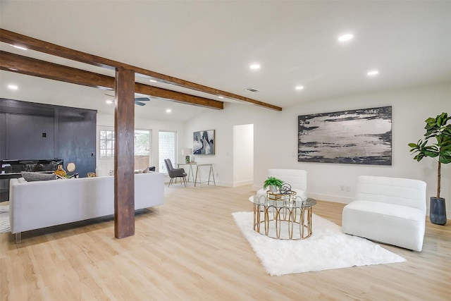 sitting room with lofted ceiling with beams, recessed lighting, visible vents, baseboards, and light wood-type flooring