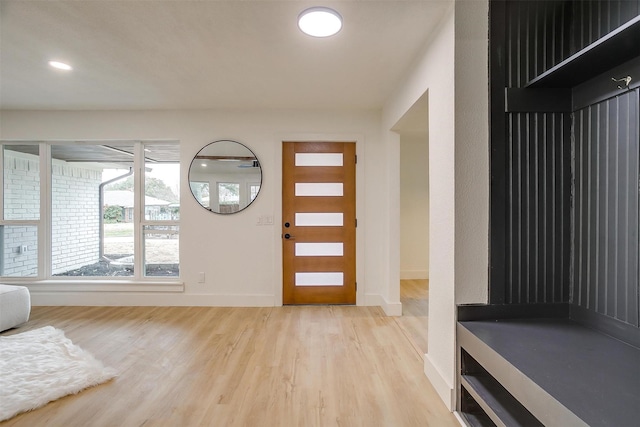 entryway featuring light wood-type flooring, baseboards, and recessed lighting