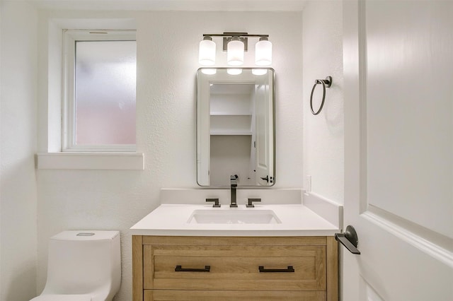 half bath with vanity and toilet