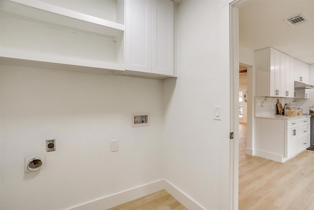 clothes washing area with light wood finished floors, baseboards, visible vents, washer hookup, and electric dryer hookup