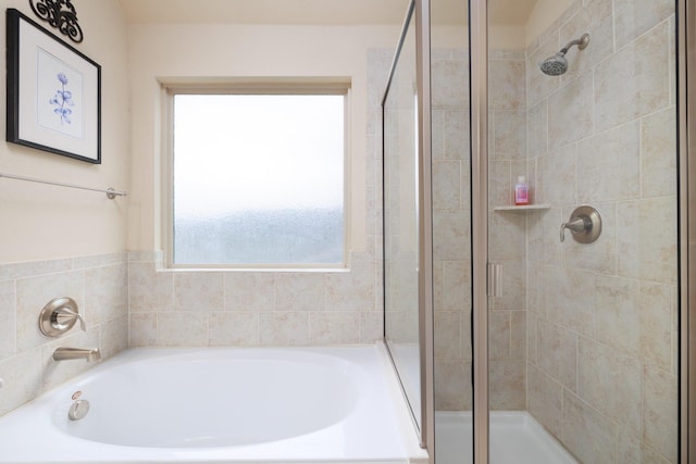 full bathroom with a garden tub and a shower stall