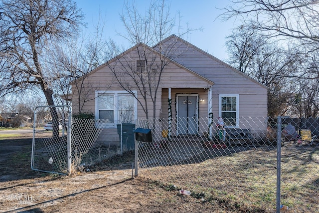 bungalow-style home with a fenced front yard