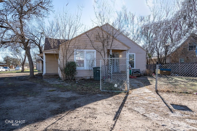 back of house with fence