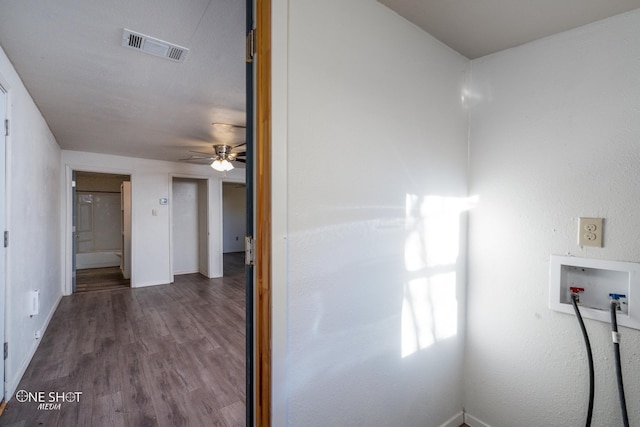 clothes washing area featuring hookup for a washing machine, baseboards, visible vents, and dark wood finished floors