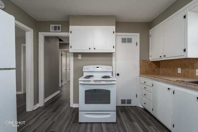 kitchen featuring light countertops, white appliances, white cabinets, and visible vents