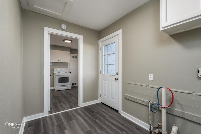 doorway to outside with visible vents, baseboards, and dark wood finished floors