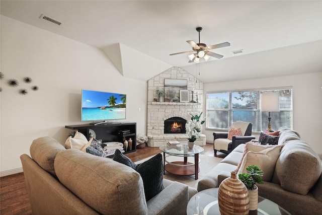 living room featuring lofted ceiling, a ceiling fan, visible vents, and wood finished floors