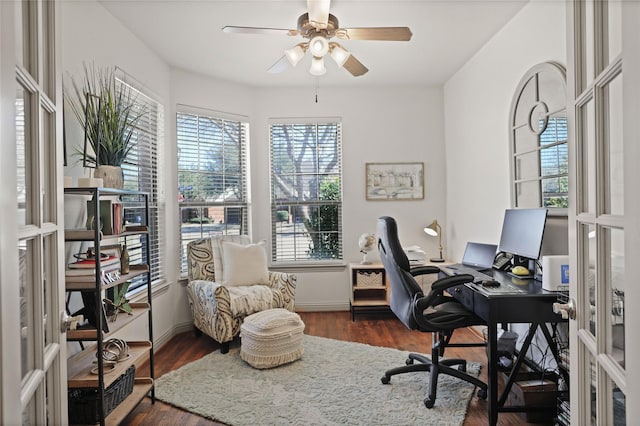 office with french doors, wood finished floors, a ceiling fan, and baseboards