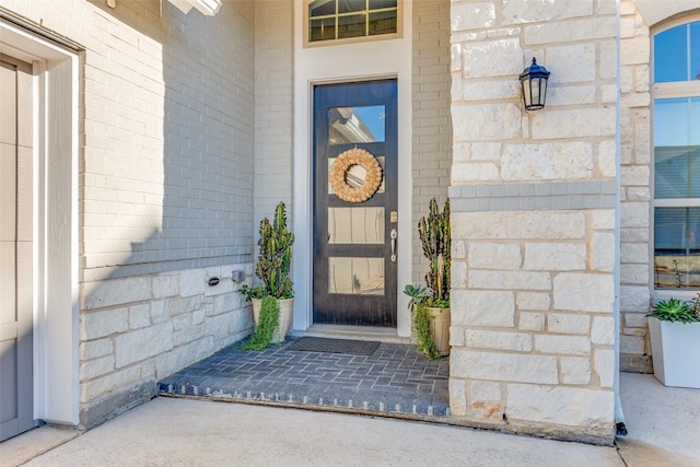 entrance to property with brick siding