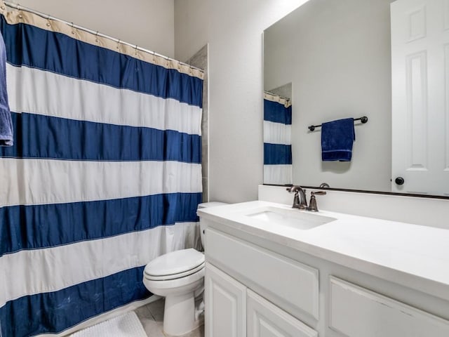 bathroom with toilet, a shower with curtain, tile patterned flooring, and vanity