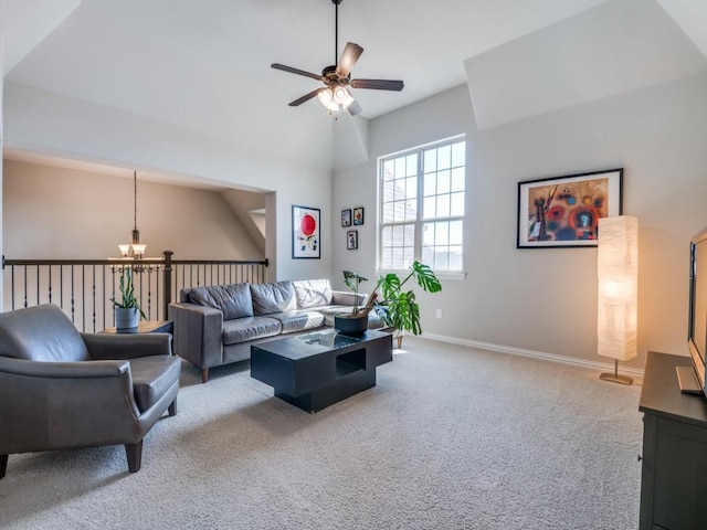 carpeted living area with baseboards, a ceiling fan, and lofted ceiling