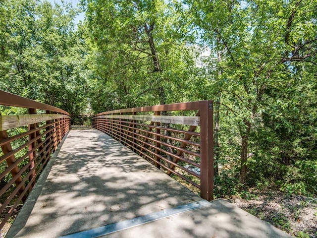 view of gate featuring a forest view