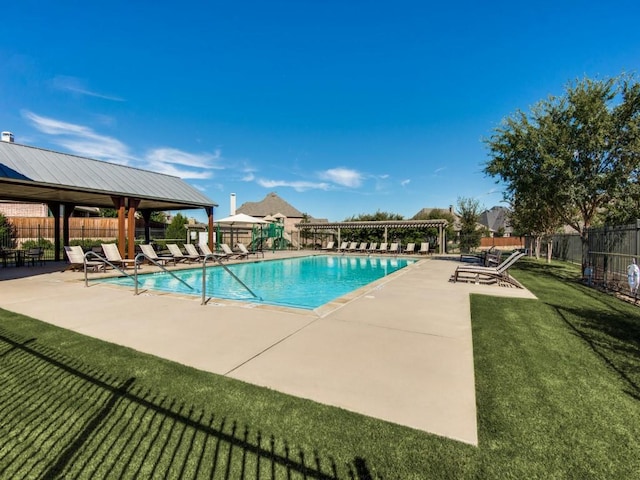 community pool featuring fence, a patio, and a gazebo