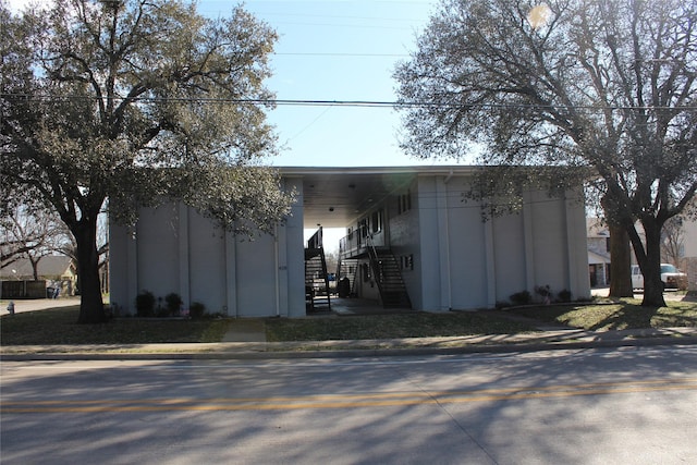 view of outbuilding featuring stairs