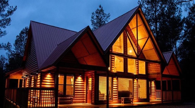 rear view of house with metal roof