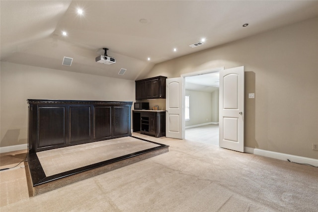 cinema with light carpet, visible vents, baseboards, lofted ceiling, and recessed lighting