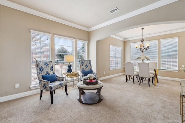 sitting room with arched walkways, crown molding, light colored carpet, visible vents, and baseboards