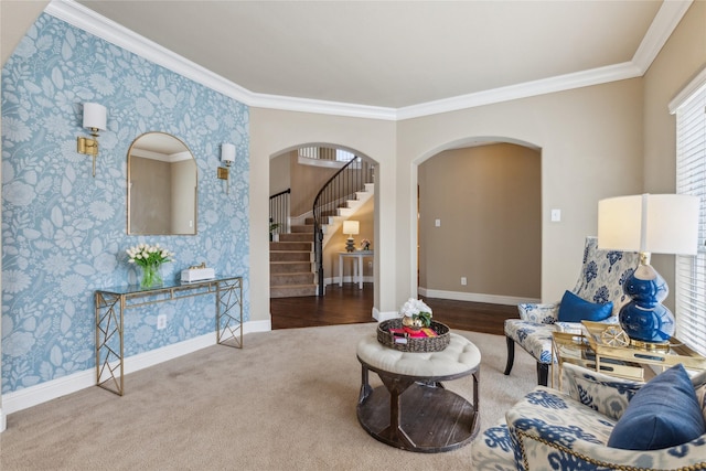 living area featuring baseboards, stairs, and arched walkways