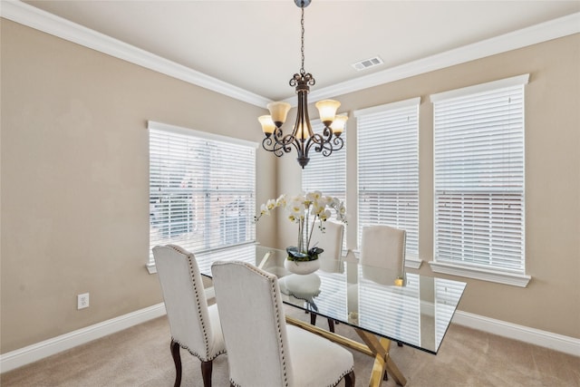 dining area with baseboards, carpet, visible vents, and crown molding