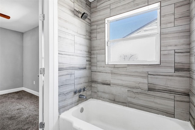 full bathroom featuring bathing tub / shower combination and baseboards