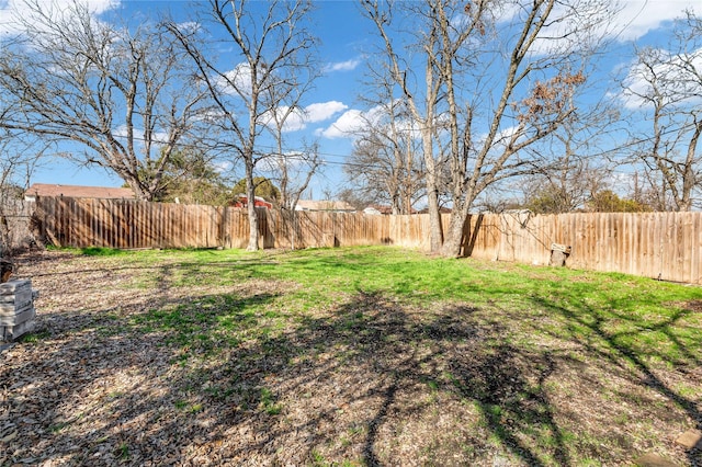 view of yard featuring a fenced backyard