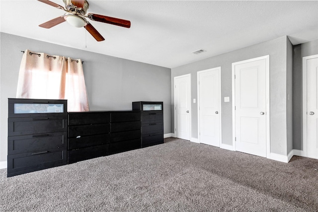 unfurnished bedroom featuring baseboards, visible vents, and carpet flooring