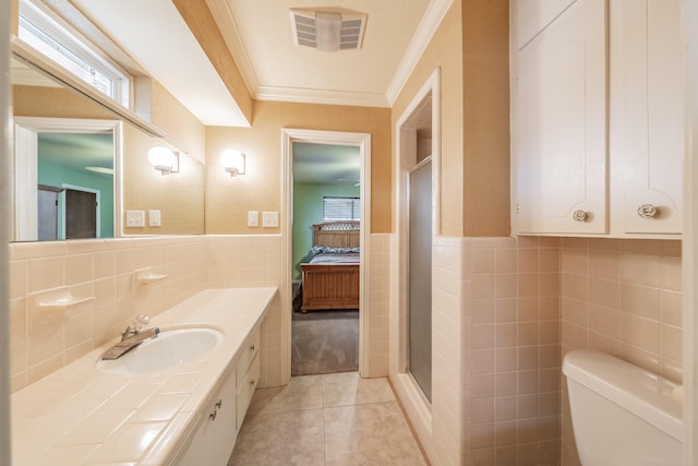 ensuite bathroom with visible vents, ensuite bath, ornamental molding, tile patterned flooring, and tile walls