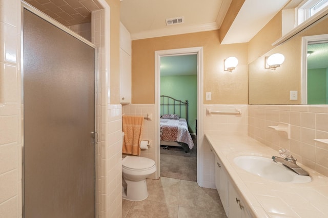 bathroom with a stall shower, visible vents, tile patterned floors, ensuite bathroom, and tile walls