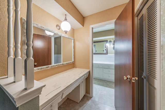 bathroom featuring tile patterned floors and vanity