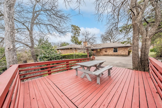 wooden terrace featuring a patio