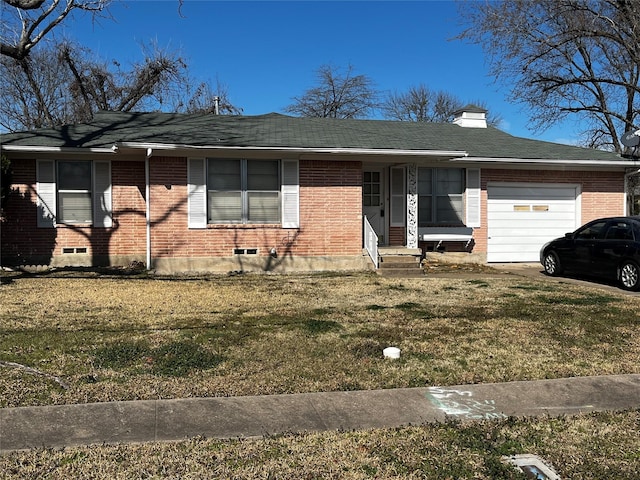 single story home featuring a garage, brick siding, and a front lawn