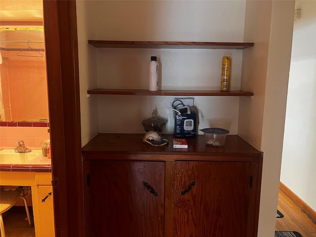 room details featuring decorative backsplash and a sink