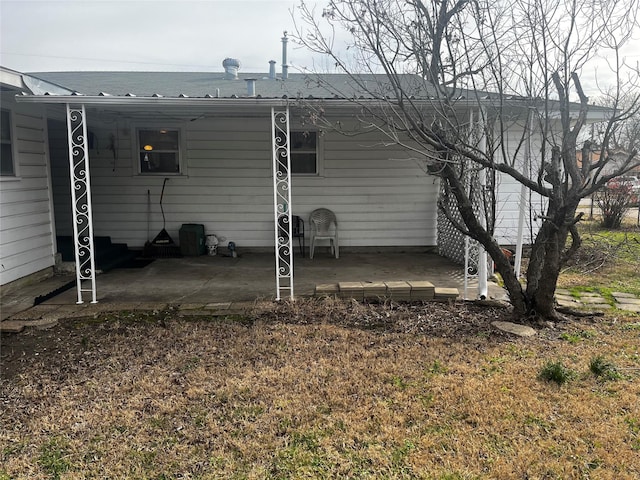 back of property featuring a patio