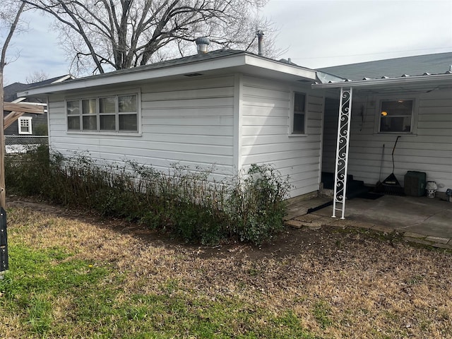 view of side of property featuring fence