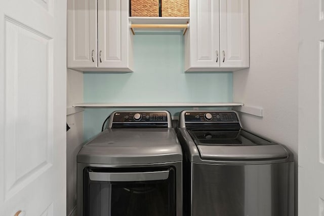 laundry room with cabinet space and independent washer and dryer