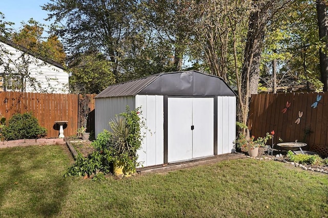 view of shed featuring a fenced backyard