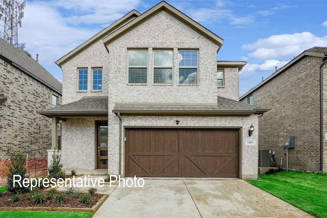 view of front of house with roof with shingles, driveway, an attached garage, and central air condition unit