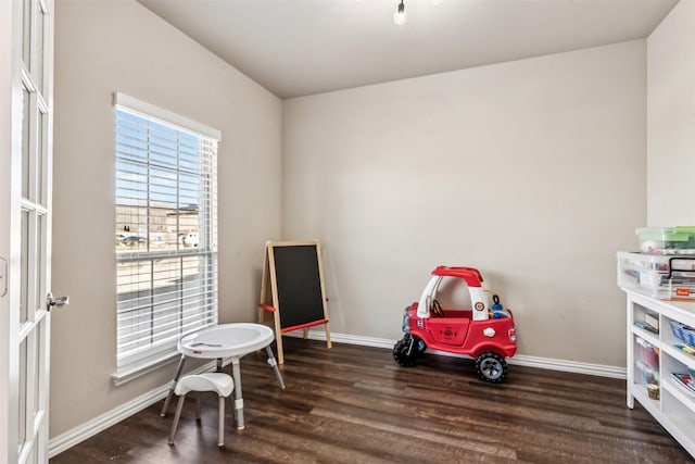 rec room with dark wood-style flooring and baseboards