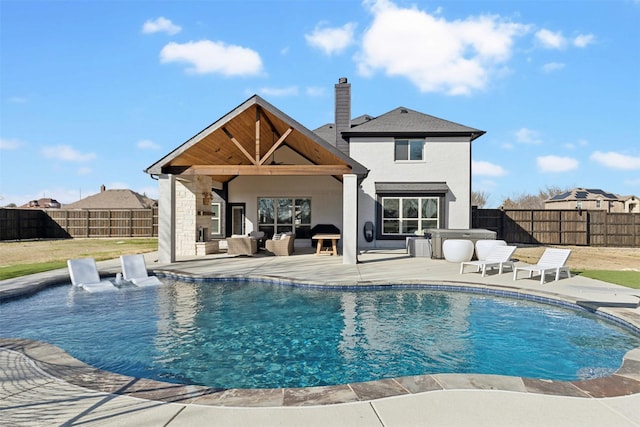 view of pool with a fenced backyard, an outdoor living space, a fenced in pool, and a patio