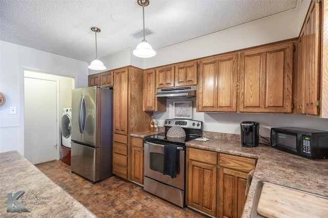 kitchen featuring visible vents, brown cabinetry, washer / clothes dryer, stainless steel appliances, and under cabinet range hood